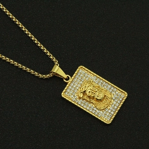 Hip hop gold plated necklace featuring a Jesus head pendant with sparkling rhinestones