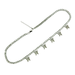 Close-up of silver butterfly pendants and zircon tennis chain with lobster clasp