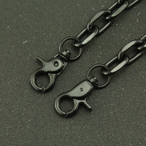 Detail of black metal lobster clasps and Cuban chain links with matte finish