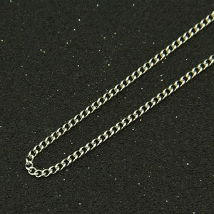 Macro view of polished silver titanium steel chain links with a bright metallic finish