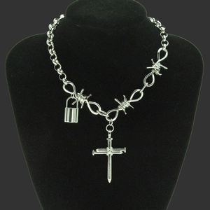 Punk gothic thorn cross necklace with silver lock pendant on a black display stand