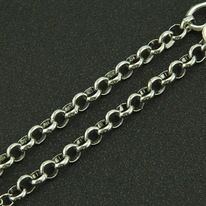 Macro view of a polished silver metal ring chain necklace with precise craftsmanship
