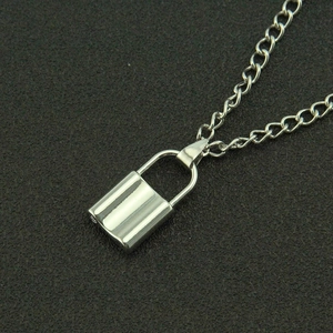 Industrial silver padlock pendant necklace with polished metal link chain on grey background