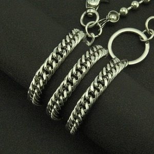 Close-up of silver metal cuban links and circular loops for men street punk pants chain