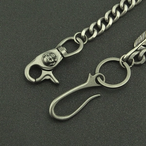 Vintage Cuban link pants chain with skull hook and detailed feather pendant in silver