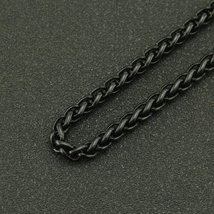 Macro view of matte black electrophoresis wheat chain link with heavy metal industrial design