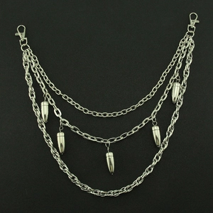 Three-layer punk metal wallet chain with bullet pendants and lobster clasps on black background