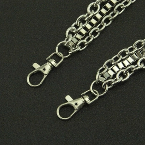 Multi-layer punk hip hop waist chain with silver lobster clasps on black texture