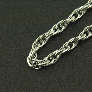 Macro view of triple-layered silver metal chains with dense punk rock links