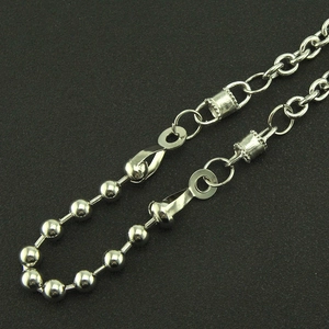 Close-up of silver punk trousers chain with ball and lobster clasp link details