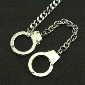 Polished silver metal handcuff wallet chain for men with Cuban link accessory details