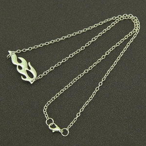 Minimalist silver flame pendant necklace with adjustable chain on dark background
