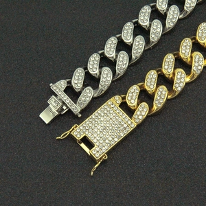 Iced out 20mm Cuban chain bracelet in gold and silver finish with pavé set crystals