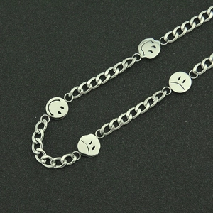 Polished stainless steel chain necklace featuring multiple silver emoticon smiley pendants