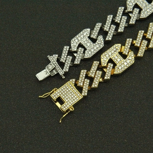 Iced out Cuban link bracelets in gold and silver finish with diamond-encrusted buckles