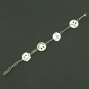 Close-up of stainless steel bracelet featuring multiple round smiley face emoji charms