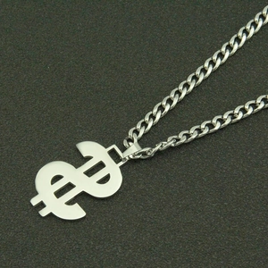 Macro detail of silver dollar sign pendant with classic stainless steel curb chain