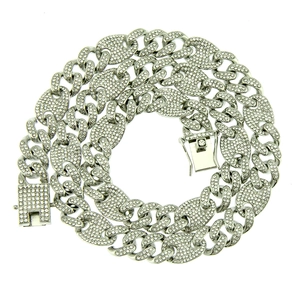 Macro detail of silver iced out coffee bean link chain with sparkling pavé crystals