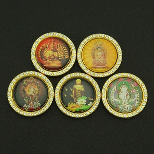Set of five rotating Buddhist amulets with gold frames and sparkling rhinestones