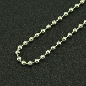 Cool hip-hop style silver metal ball chain belt for men and women on a black texture