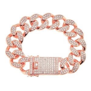 Macro shot of 20mm wide rose gold Cuban link bracelet with iced out crystals and square buckle