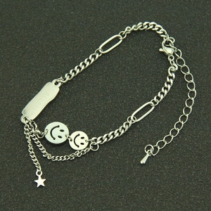 Silver stainless steel smiley face bracelet with I BELIEVE bar and star pendant