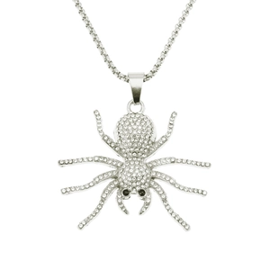 Macro shot of silver spider pendant with clear rhinestones and black gem eyes
