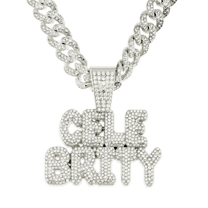 Close-up of iced out silver Cuban chain with CELEBRITY letter pendant in hip hop style