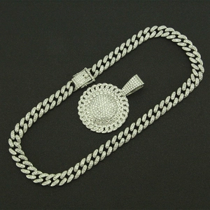 Macro shot of silver hip hop Cuban chain with spinning sunflower pendant set in rhinestones