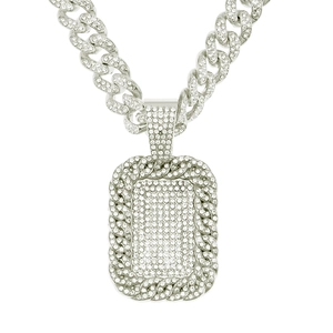 Detail of silver Cuban chain and iced-out rectangle dog tag pendant with crystal pavé