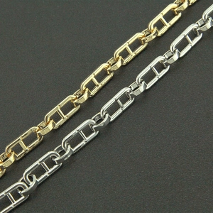 Macro view of gold and silver anchor chain link necklaces with polished mirror finish