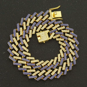 Detail of 15mm cuban link chain with set white and blue rhinestones on gold plated links