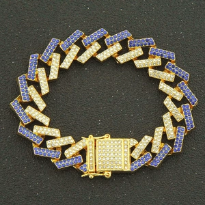 Gold Cuban link bracelet with blue and white crystals featuring a secure magnet clasp