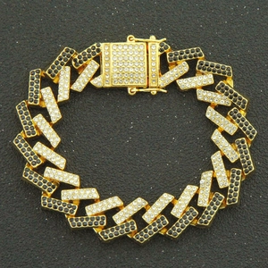 Macro detail of 15mm Cuban link bracelet with black and white pavé rhinestones