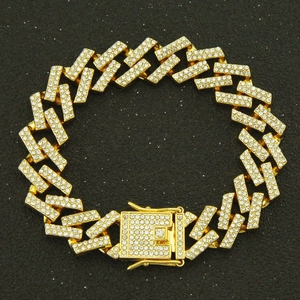 Macro shot of gold-plated Hip-hop Cuban chain with iced-out crystals and a box clasp