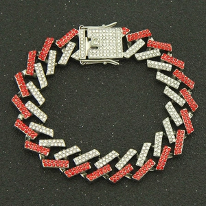 Detailed close-up of 15mm Cuban link bracelet with red and white iced-out rhinestones
