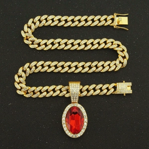 Gold Cuban link necklace with oval ruby pendant and micro-pave crystals in hip-hop style