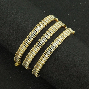Three rows of gold tennis bracelets with baguette cut cubic zirconia in claw setting