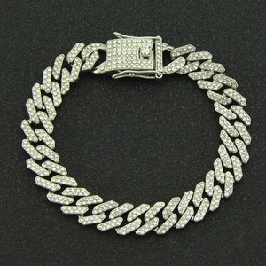 Detailed close-up of iced out silver Cuban link chain with pave set zircons
