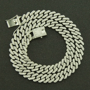 Close-up of hip-hop silver Cuban link chain featuring micro-paved iced out clear diamonds