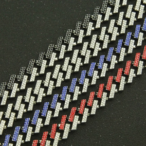 Detailed close-up of 15mm Cuban link chains with multi-color rhinestones in hip hop style