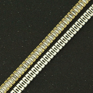 Close-up of gold and silver necklaces with baguette-cut sparkling cubic zirconia crystals