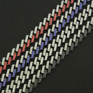 Macro detail of 15mm cuban link bracelet featuring colorful rhinestones and magnetic clasp