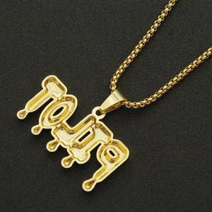 Close-up of gold 7019 dripping number pendant necklace with beaded chain detail