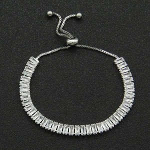 Close-up of adjustable silver zircon bracelet with rectangular crystals and slide buckle