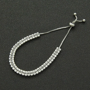 Detail of adjustable silver bracelet with rectangular links and cubic zirconia stones