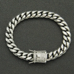 Close-up of silver Cuban link chain bracelet with a square buckle set with white rhinestones