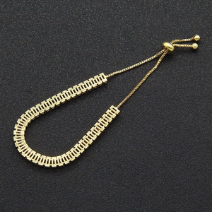 Adjustable gold zircon bracelet with geometric links for women on black background