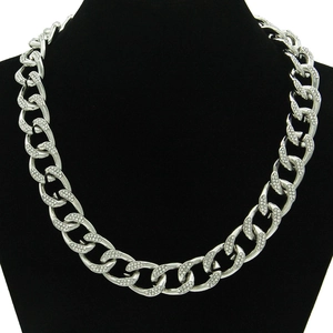 Hip hop silver Cuban chain necklace with iced out rhinestones on black velvet display