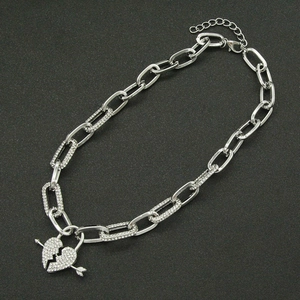 Silver iced out Cuban chain necklace with heart and arrow pendant for women and men